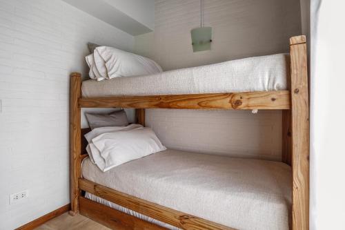 a couple of bunk beds in a room at Valeria House Rental Suites in Valeria del Mar