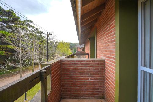 a brick wall on the side of a house at Valeria House Rental Suites in Valeria del Mar