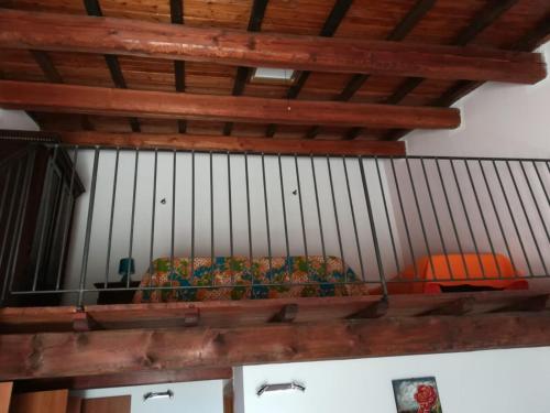 a couch in a room with a wooden ceiling at Agriturismo le cascine in Castel di Tora