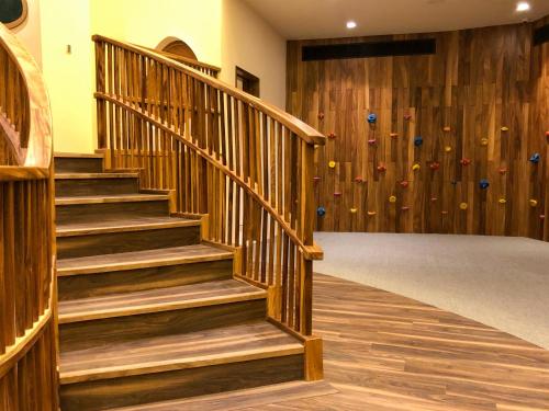 a staircase in a gym with a climbing wall at Nobu Hotel Los Cabos in Cabo San Lucas