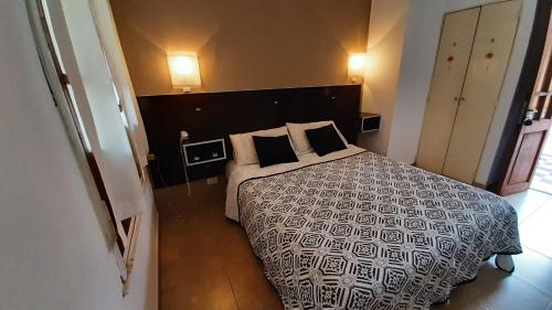 Ένα ή περισσότερα κρεβάτια σε δωμάτιο στο Hotel Uritorco