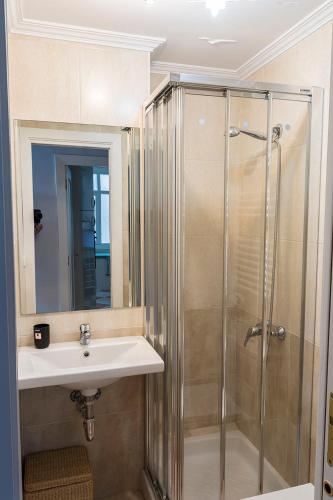 a bathroom with a sink and a shower at Txingudi by Basquelidays in Hondarribia