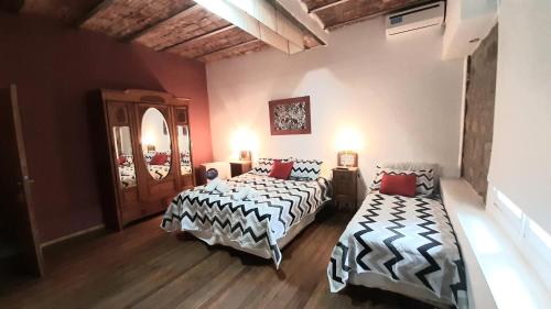 Ένα ή περισσότερα κρεβάτια σε δωμάτιο στο Hotel Uritorco