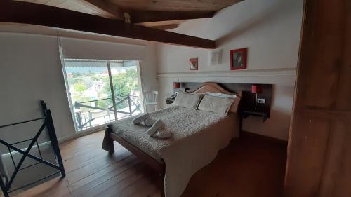Ένα ή περισσότερα κρεβάτια σε δωμάτιο στο Hotel Uritorco
