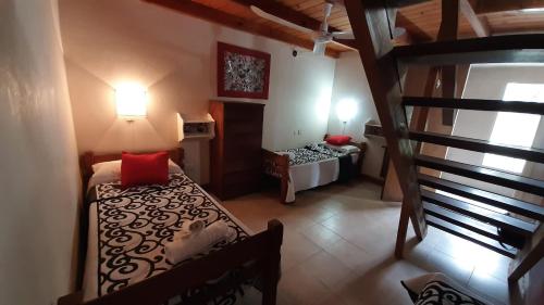 Ένα ή περισσότερα κρεβάτια σε δωμάτιο στο Hotel Uritorco