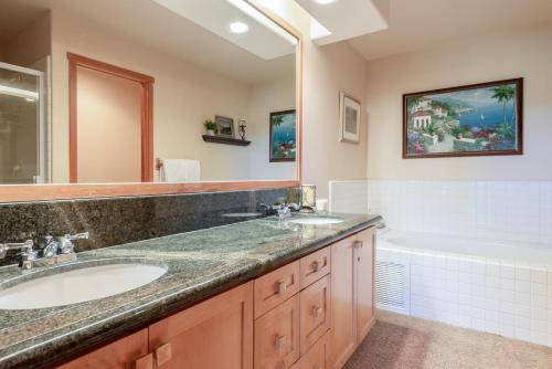 a bathroom with two sinks and a tub at Snowcreek V 756 in Mammoth Lakes