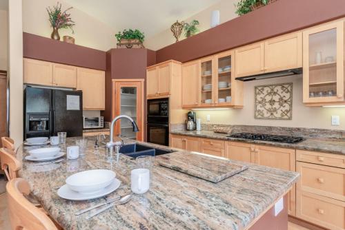 a large kitchen with a large counter top with a sink at Snowcreek V 756 in Mammoth Lakes