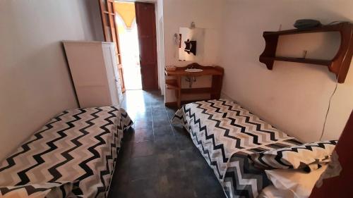Ένα ή περισσότερα κρεβάτια σε δωμάτιο στο Hotel Uritorco