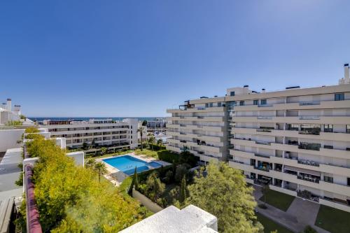 an overhead view of a building with a swimming pool at Vila Marina - Luxurious apartment - Sea view in Vilamoura