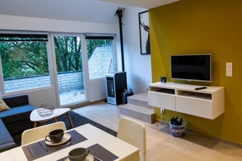 TV a/nebo společenská místnost v ubytování Côté terrasse