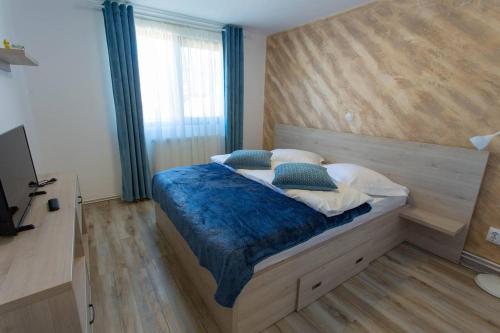 Ένα ή περισσότερα κρεβάτια σε δωμάτιο στο Apartamente Primaverii 2