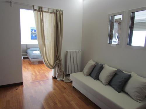 a living room with a couch and a window at Room 56 - Le Dimore in Bari