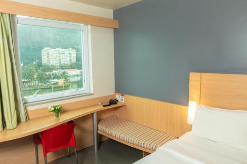 Кровать или кровати в номере ibis Rio de Janeiro Barra da Tijuca