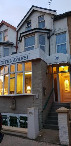 a building with a hostel amresist sign on it at Hotel Avansi in Blackpool