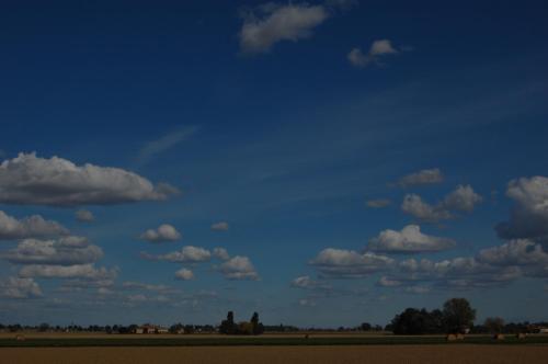 a blue sky with white clouds in a field at B&B L'Alberone in Budrio