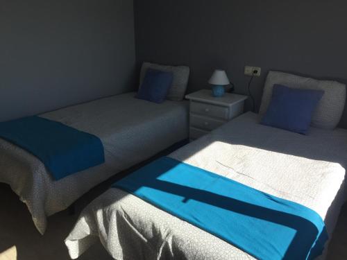 Posteľ alebo postele v izbe v ubytovaní Apartamentos Susa