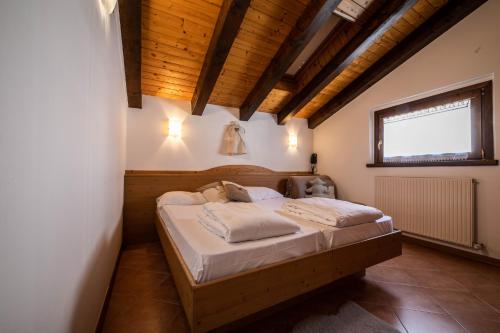 Tempat tidur dalam kamar di Osteria Da Alvise