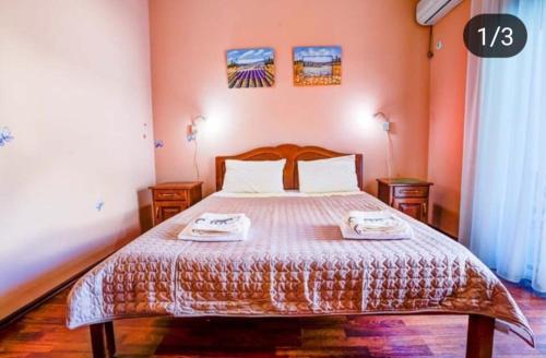 a bedroom with a bed with two towels on it at Villa Elkom, App 6 in Ulcinj