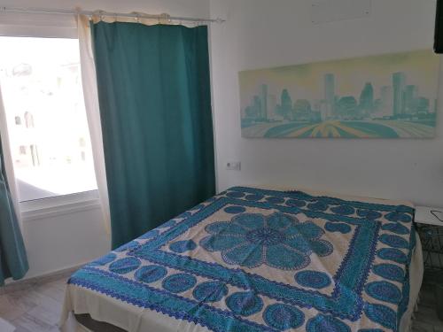 Кровать или кровати в номере wonderful white appartament in las Tortugas