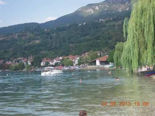 a body of water with a boat in it at Lile Pestani Accommodation in Peštani
