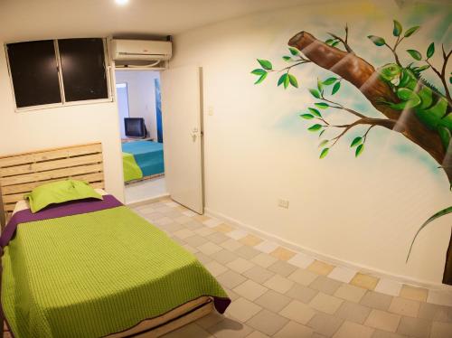 מיטה או מיטות בחדר ב-Apartamentos Turísticos In Di Town