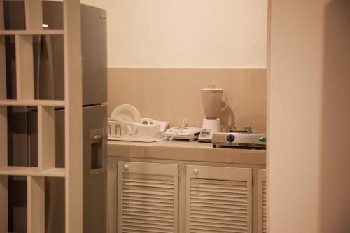 Kuchyň nebo kuchyňský kout v ubytování Apartamentos Turísticos In Di Town