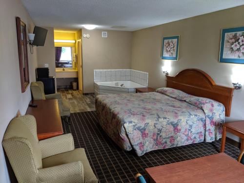 מיטה או מיטות בחדר ב-Economy Inn Express