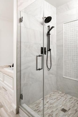 a shower with a glass door in a bathroom at Hotel Atwater in Avalon