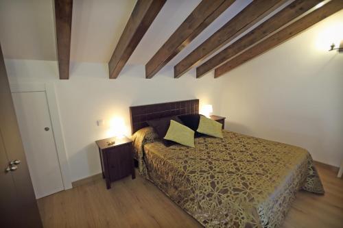 a bedroom with a bed with two pillows on it at Torre de Quintana in Suances