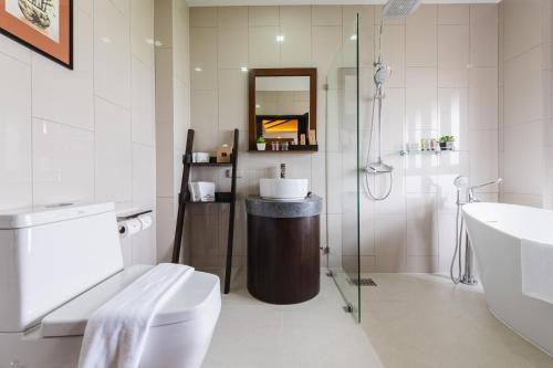 a bathroom with a sink and a toilet and a shower at El Barrio Lanna in Chiang Mai