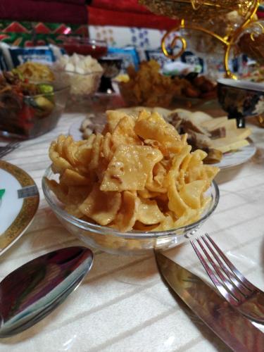 a glass bowl of food on a table at RAHAT Guest House & Hostel in Toktogul in Toktogul