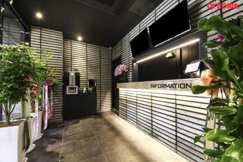 a lobby with a sign that reads immigration at Stay Month Hotel in Goyang