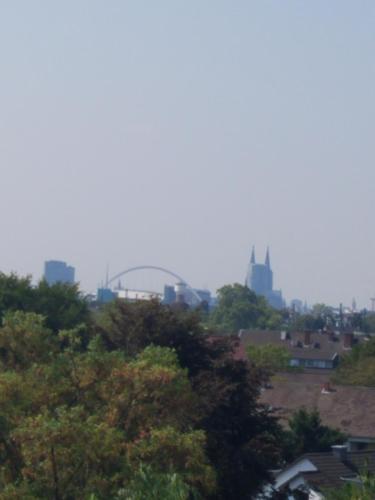 a view of a city with trees and buildings at Workers-Sleep-Station in Cologne