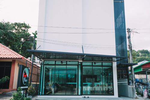 a building with glass doors in a street at Good Place in Koh Tao
