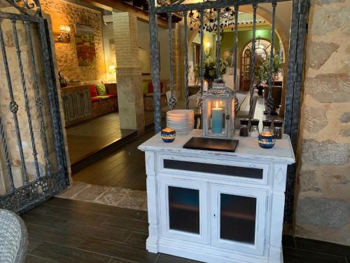 a white table with a lantern on top of it at Casa Mistela in Jalón