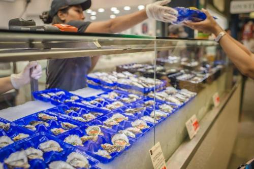 a group of people buying food in a store at Ensuite King Single Room - AC - Next to Central - Closely Located to Almost Sydney Must Seen Spots in Sydney