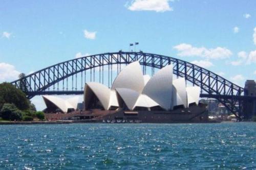 a sydney opera house with a bridge in the background at Ensuite King Single Room - AC - Next to Central - Closely Located to Almost Sydney Must Seen Spots in Sydney