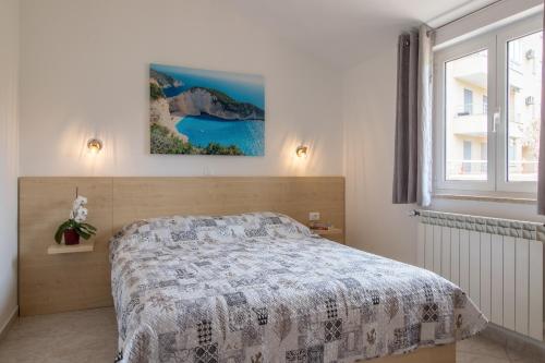 Posteľ alebo postele v izbe v ubytovaní Apartments Ivica 1706