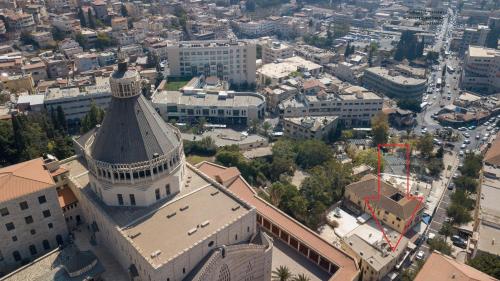 an overhead view of a building with a tower at La Casetta in Nazareth