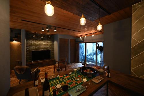 a living room with a chess board on a table at Inari Ohan in Kyoto