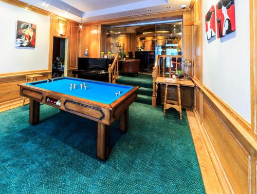 a billiard room with a pool table in it at Hotel Pacific in Ostend