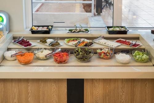 a buffet line with many different types of food at Hermes Hotel in Kissamos