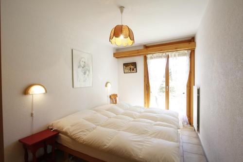 Postel nebo postele na pokoji v ubytování Residence Tsaumiau