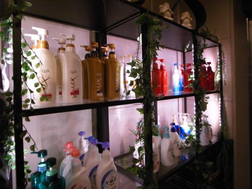a refrigerator filled with lots of glass bottles at Comfort Hotel Hu in Koshigaya