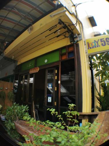 a building with the entrance to a store at Indy house59 in Bangkok