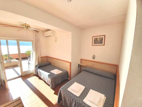 Postel nebo postele na pokoji v ubytování Hotel Castell - Montagnoli Group