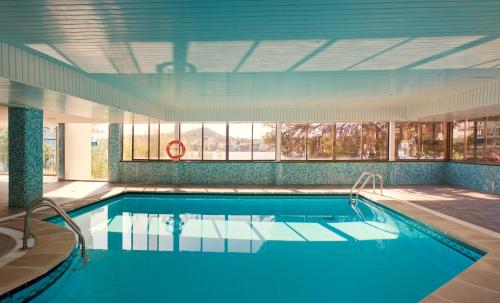 a large swimming pool in a building at TRH Jardín Del Mar in Santa Ponsa