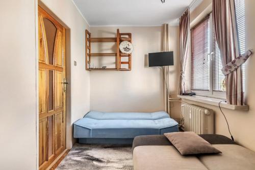 Postel nebo postele na pokoji v ubytování Mieszkanie Przy Wieżach