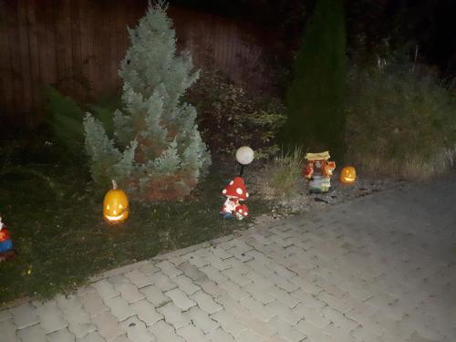 a group of miniature christmas decorations in a yard at Hotel Dennis in Mediaş