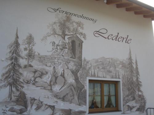 a mural on the side of a building with the words regenerating negotiate at Ferienwohnung Lederle Maria-Luise in Jerzens